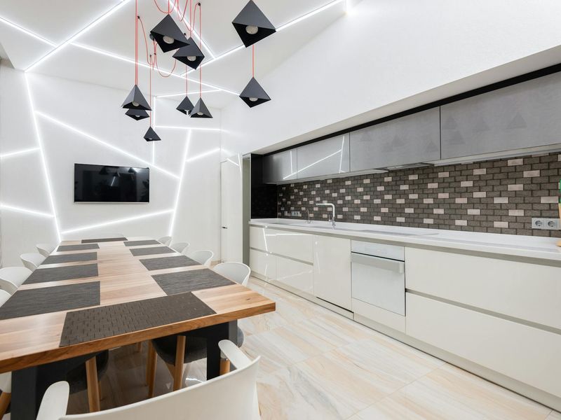 Spacious minimalist room with natural light and a mat.